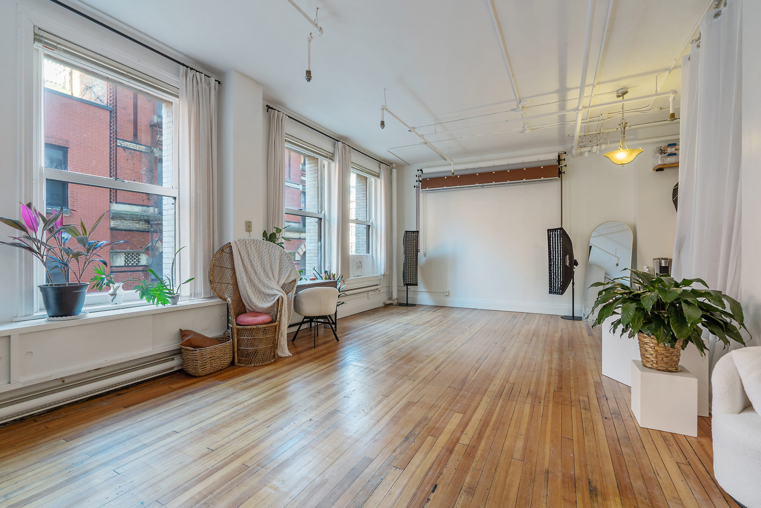 Natural light photo studio in Syracuse with wide open shooting space and large windows