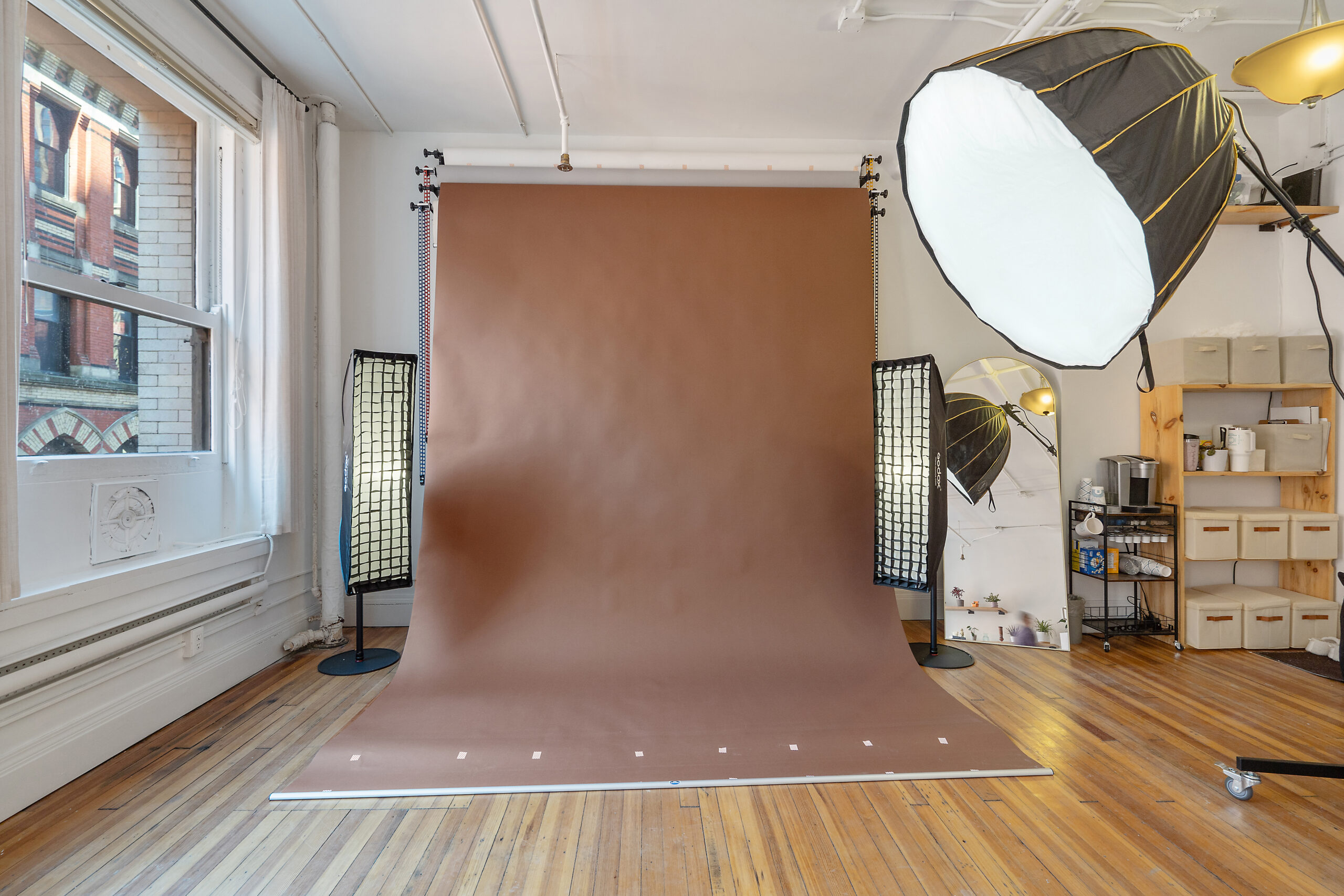 Natural light photo studio in Syracuse with mauve backdrop and softbox lighting